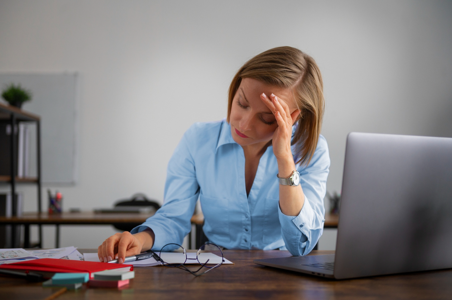 Exhausted person at a desk